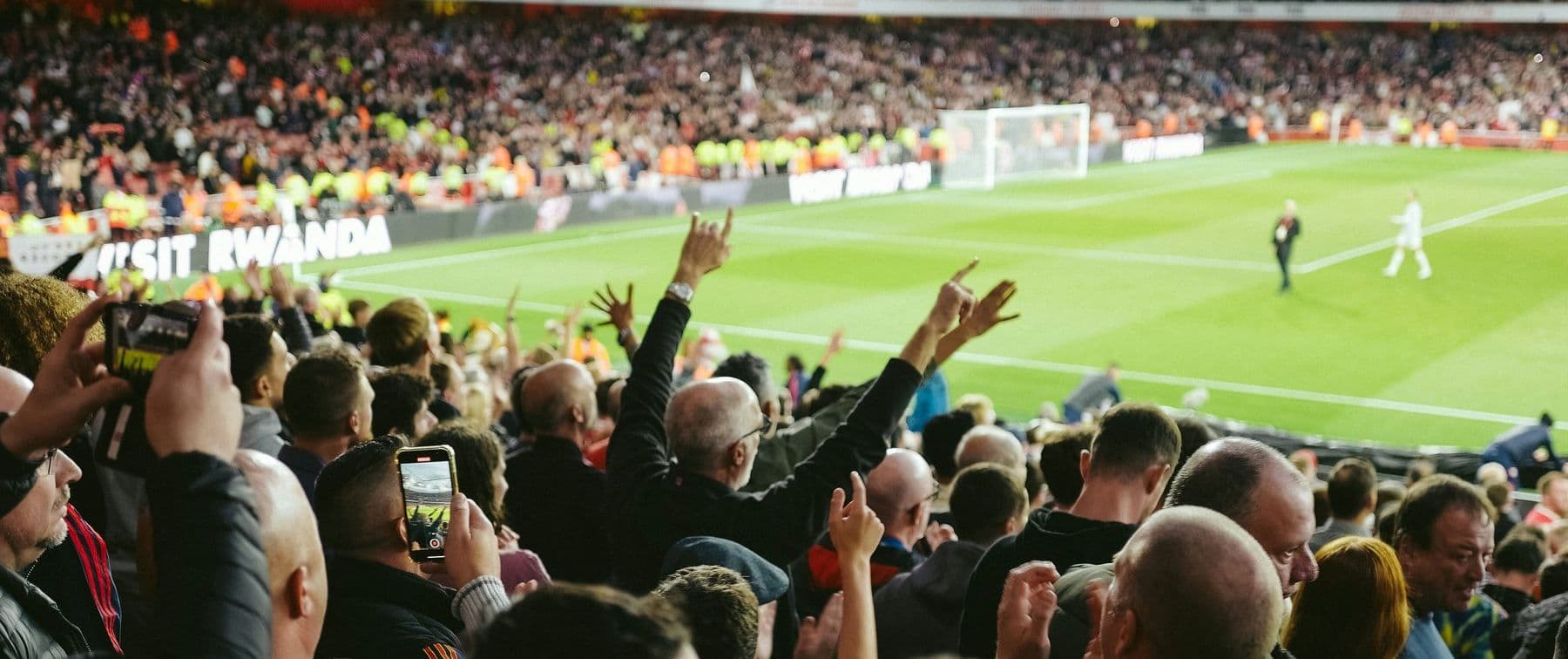 Fans celebrating at a football match